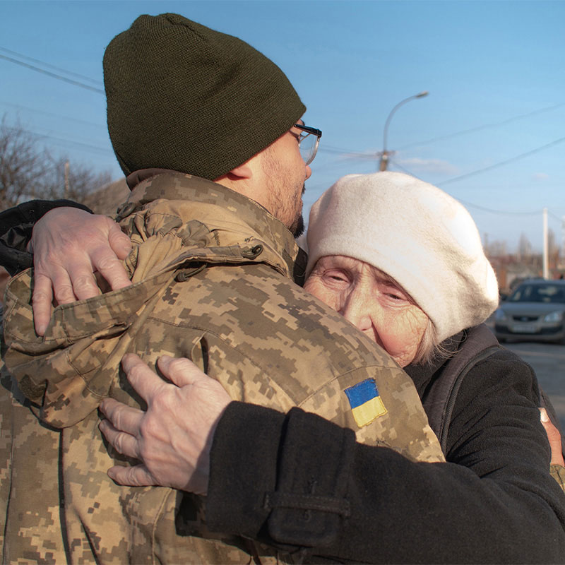 soldier and woman hugging